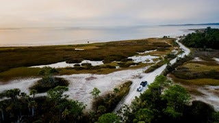 Image of an early morning drive at the Wakulla Beach boat ramp.