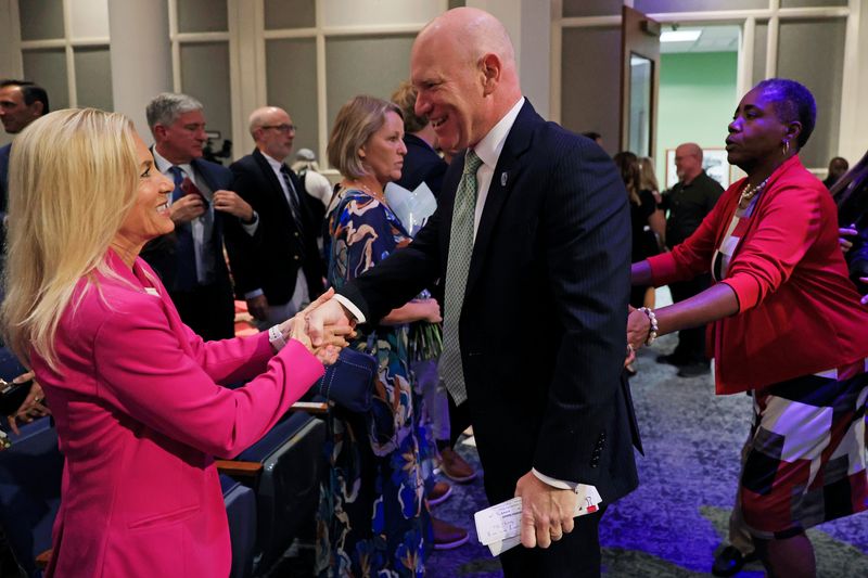 Newly sworn in City Council President Nick Howland is greeted by Mayor Donna Deegan during an installation ceremony of City Council leadership, Thursday, June 25, 2026, in Jacksonville, Fla. Council members Nick Howland was sworn in as City Council President and Joe Carlucci as Vice President. Their one-year terms begin July 1.