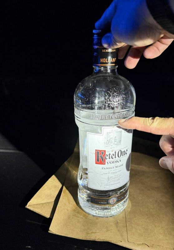 Titusville police located a partially empty vodka bottle in an unmarked Titusville Police-issued SVU driven by former chief John Lau, who was involved in a single-vehicle crash along Barna Road outside city limits late June 23.