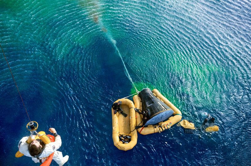 Gemini X landed in the Atlantic Ocean on July 21, 1966. Astronaut John Young is hoisted from the water by a recovery helicopter.