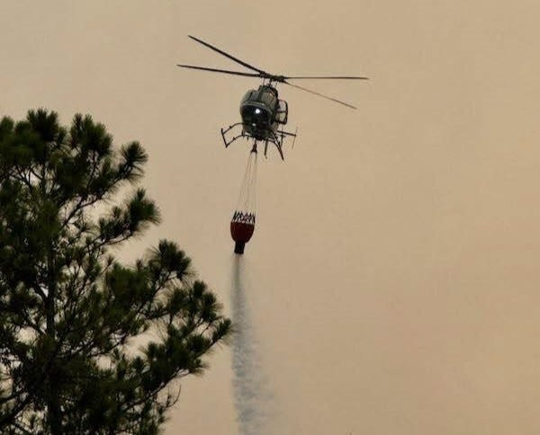 A Volusia Sheriff's Office helicopter drops water on the Maytown area brush fire in Volusia County on June 26.