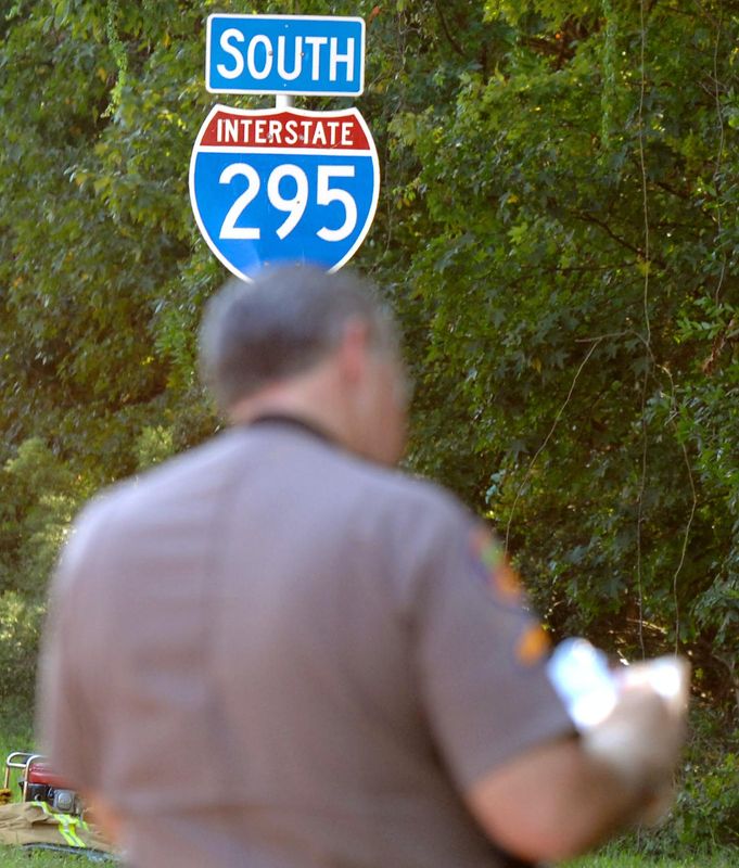 A Florida Highway Patrol trooper works a fatal crash on Interstate 295 in Jacksonville in 2007.