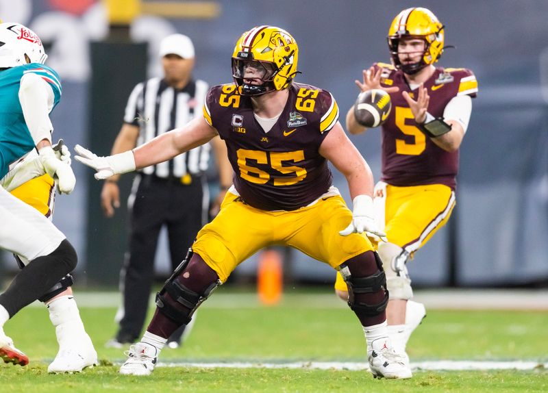 Dec 26, 2025; Phoenix, AZ, USA; Minnesota Golden Gophers offensive lineman Greg Johnson (65) against the New Mexico Lobos during the Rate Bowl at Chase Field. Mandatory Credit: Mark J. Rebilas-Imagn Images