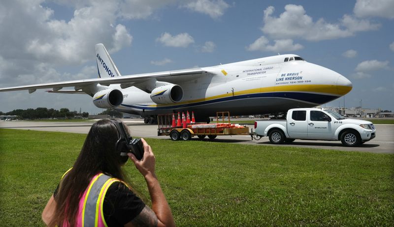A Sheltair Aviation crew member  near the Antonov AN-124, the world’s largest operating cargo plane, after it landed at Melbourne Orlando International Airport on Sunday, June 28 before 12:30 p.m. It is operated by the Ukrainian carrier Antonov Airlines, and last visited Melbourne in March, 2024.
