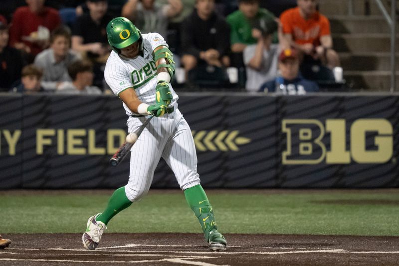 Oregon infielder Naulivou Lauaki Jr. hits a home run to tie the game in the ninth inning as the Oregon Ducks host the USC Trojans on May 14, 2026, in Eugene, Oregon.