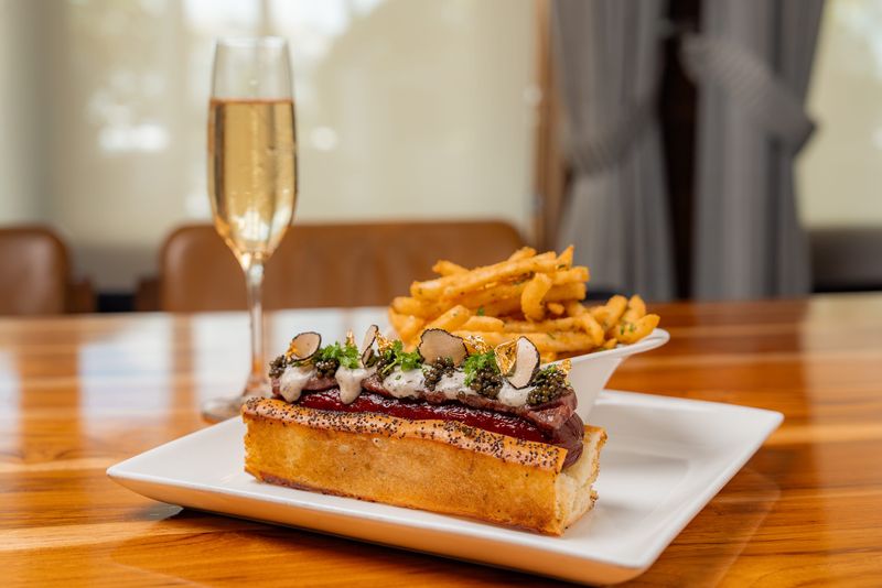 1000 North's 250th Anniversary Hot Dog will be available all day on July 4 and features A5 Wagyu sashimi, truffle crème fraîche, caviar, and shaved truffle.