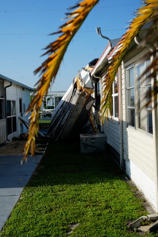 Crews clean up debris left behind from an EF-0 tornado at Tamiami Village and R.V. Park in  North Fort Myers on Monday, June 29, 2026. The tornado impacted several homes in the park on Sunday afternoon.