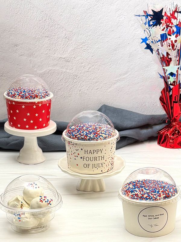 Dot Cakes are individual dessert cups made by layering cake rounds and frosting inside a container. The tops are then dipped into colorful nonpareils.