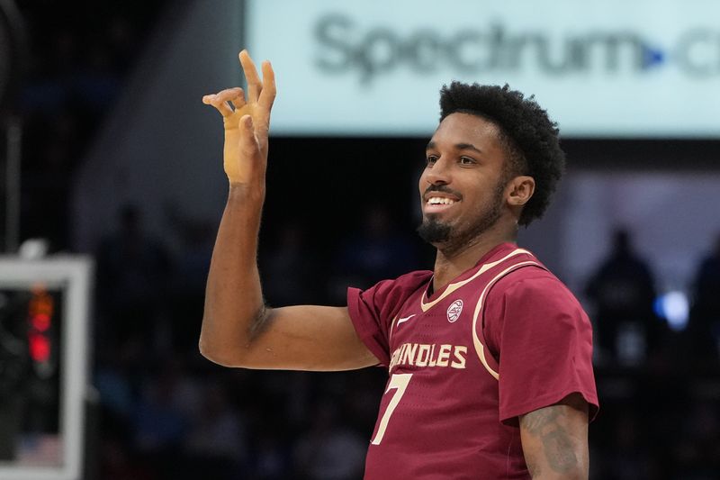 Mar 12, 2026; Charlotte, NC, USA; Florida State Seminoles forward Chauncey Wiggins (7) reacts after scoring in the first half at Spectrum Center. Mandatory Credit: Bob Donnan-Imagn Images