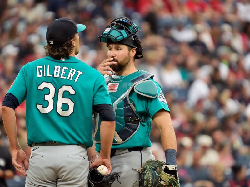 Seattle Mariners catcher Cal Raleigh talks to pitcher Logan Gilbert, left, in a break in the action against the Cleveland Guardians during a Major League Baseball game on June 27, 2026, at Progressive Field in Cleveland, Ohio. The Guardians won, 4-3.