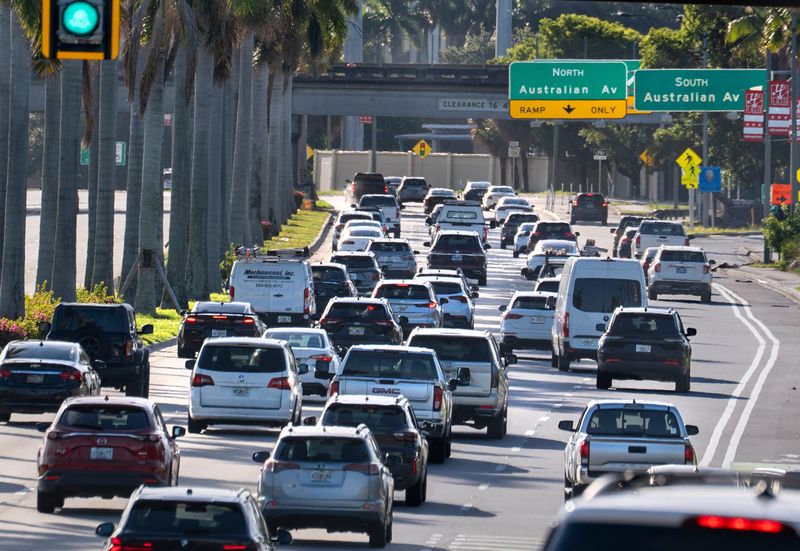 Motorists travel east along Okeechobee Blvd., towards downtown during early morning rush hour on July 5, 2026 in West Palm Beach, Florida.