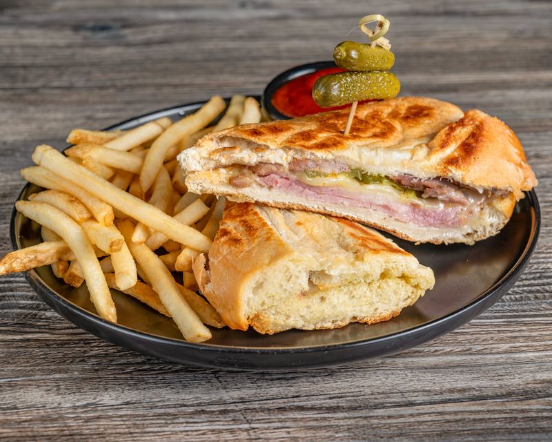 A perfectly pressed Cuban sandwich awaits at Arcade Time at The Mall at Wellington Green. The arcade and restaurant recently moved to a much larger location within the mall.