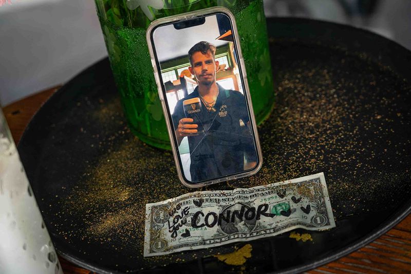 A photo of Connor Blais is displayed on a Palm Beach Post reporter's phone at the front door at O'Shea's Irish Pub in downtown West Palm Beach, Fla., on July 7, 2026. Blais was killed in a hit-and-run on South Olive Avenue and East Lakewood Road in West Palm Beach, Fla.