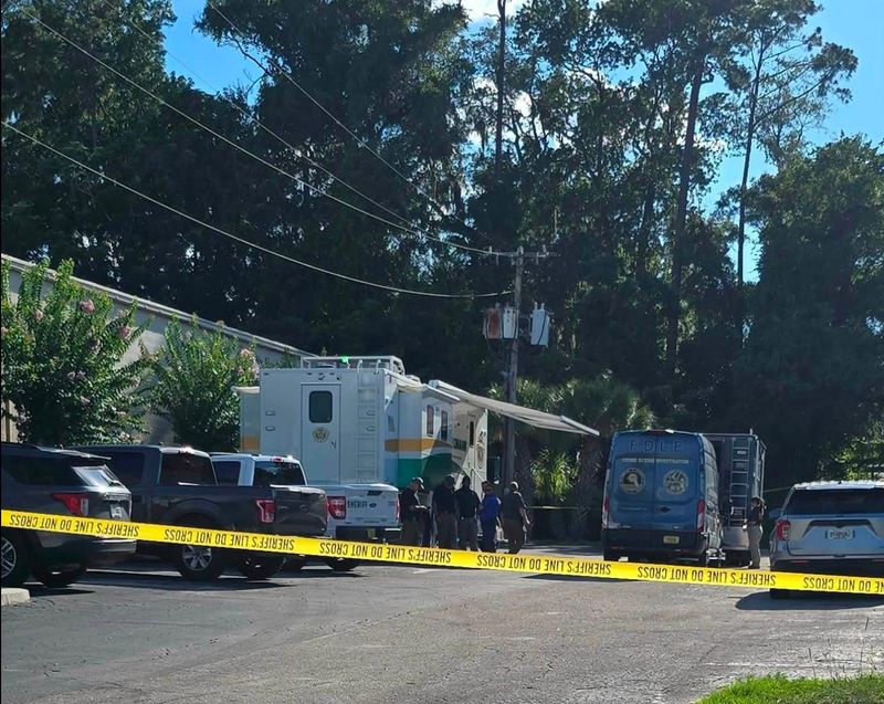The Clay County Sheriff's Office and Florida Department of Law Enforcement cordon off an area off Blanding Boulevard where a deputy wounded a suicidal gunman on July 8.
