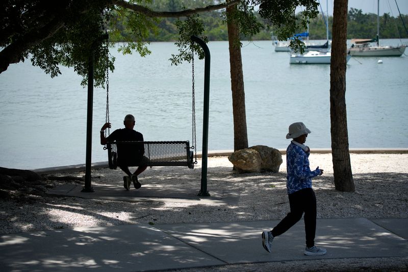 People gravitate to shady spots at Bayfront Park on Thursday, July 9, 2026. The splash pad and playground at Bayfront Park, in Sarasota, are a good place to get the kids out of the house and beat the heat. The National Weather Service issued a heat advisory for all of West Central and Southwest Florida on Thursday. With temperatures already in the upper 90s, the humidity will make feel as hot as 110 degrees.