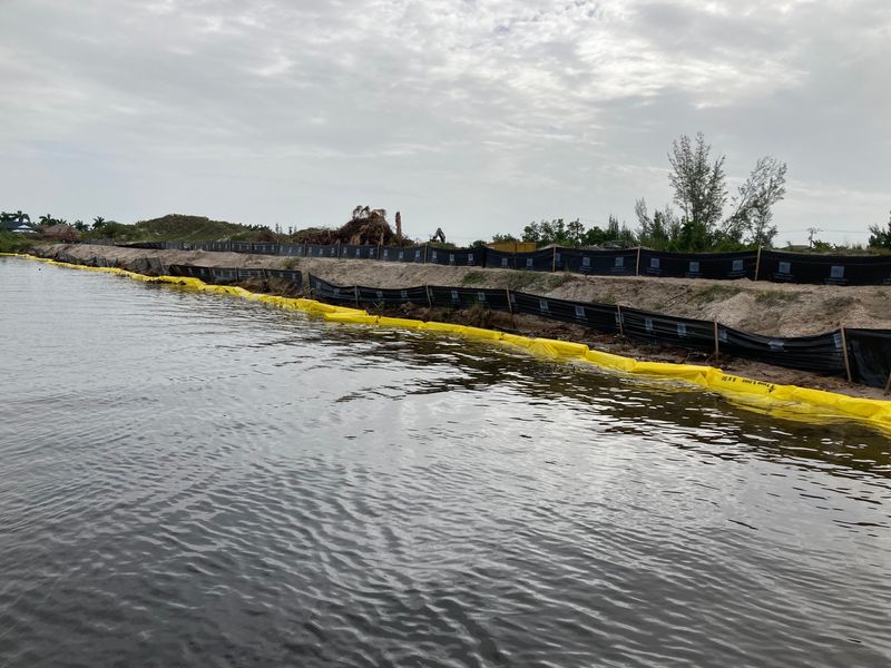Turbidity curtains and silt screens were installed around the Seven Islands property in Cape Coral on June 13, 2026. David Scott, a local geologist, said the materials were not installed properly.