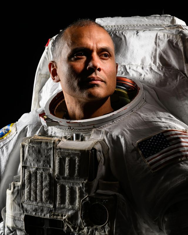 NASA astronaut Anil Menon poses in a spacesuit for a portrait at NASA’s Johnson Space Center in Houston, Texas on Jan. 8, 2026.