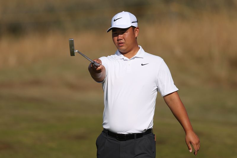 Jul 14, 2026; Southport, England; Tom Kim reacts on the third hole during a practice round for The Open Championship golf tournament at Royal Birkdale. Mandatory Credit: Bill Streicher-Imagn Images