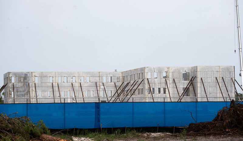 Walls are starting to go up on a new controversial high school in Alva. Photographed on Monday, July 13, 2026. The new school will provide 2000 seats for students and is located on Joel Boulevard and Tuckahoe Road.