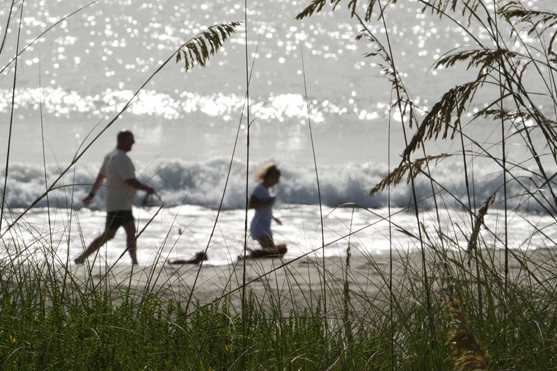 A weekday morning at Cocoa Beach, where the sand dune recovery efforts have helped the beach areas.