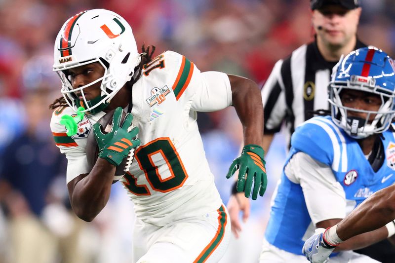 Jan 8, 2026; Glendale, AZ, USA; Miami Hurricanes wide receiver Malachi Toney (10) makes a catch against the Mississippi Rebels in the second half during the 2026 Fiesta Bowl and semifinal game of the College Football Playoff at State Farm Stadium.