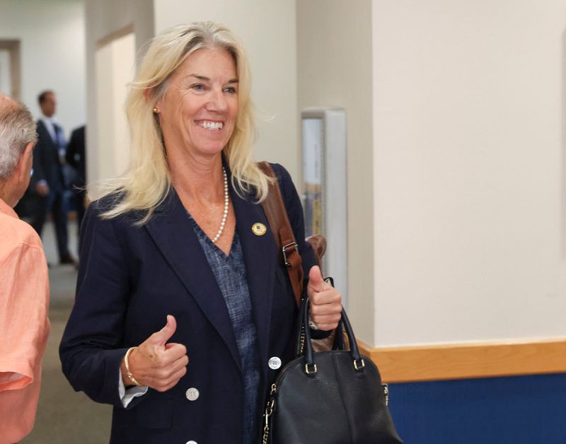 Martin County commissioner candidate Susan O'Rourke gives a thumbs up after prevailing in a case where opponent Christopher Collins alleged she lied about where she lived when she filed paperwork to run for the District 2 seat, July 15, 2026, at the Martin County Courthouse in Stuart. O'Rourke will remain on the Aug. 18 ballot with two other candidates for the District 2 Martin County Commission seat.