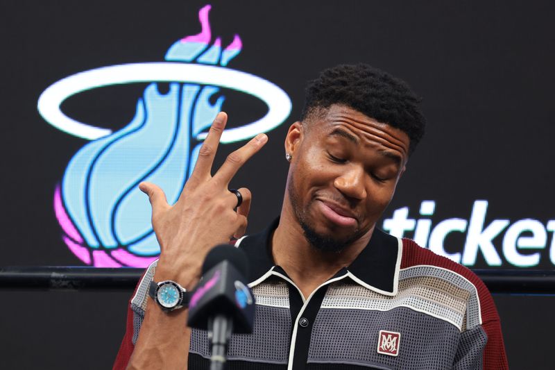 Jul 16, 2026; Miami, FL, USA; Miami Heat forward Giannis Antetokounmpo (7) reacts during his introductory press conference at Kaseya Center. Mandatory Credit: Sam Navarro-Imagn Images