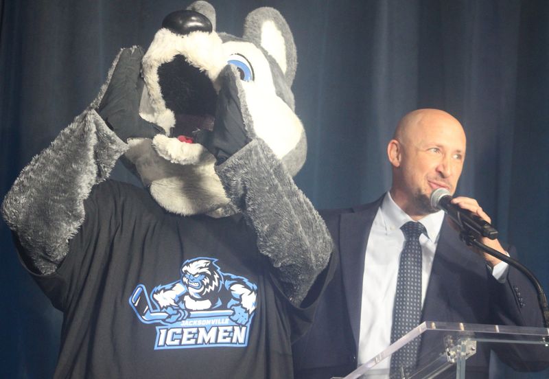 Jacksonville Icemen mascot Fang displays the club's new logo as Zawyer Sports & Entertainment CEO Andy Kaufmann speaks during the ECHL hockey club's new logo release on July 16, 2026. [Clayton Freeman/Florida Times-Union]