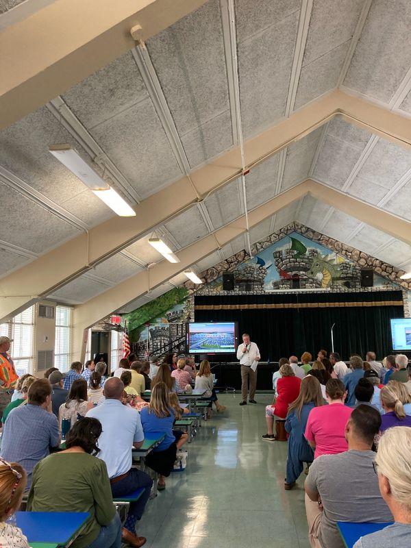 Neighbors impacted by plans to replace Venetia Elementary School with a new, larger school listen to Duval County Public Schools administrator Jim Culbert during a community meeting July 16.