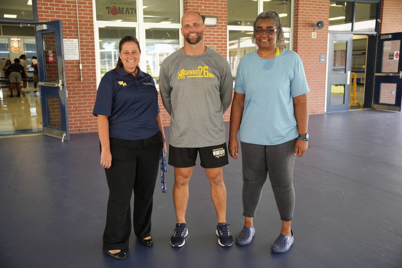 From left, Corey Boatman is announced as Winter Haven's new football coach and is with Winter Haven principal Ronda Cotter, left, and athletic director LeDawn Gibson.