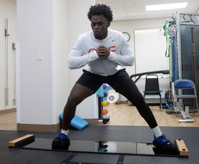 Auburndale junior Anthony Howard Jr. goes through a workout as he rehabs a knee injury at Florida Orthopedic Institute in Lakeland.