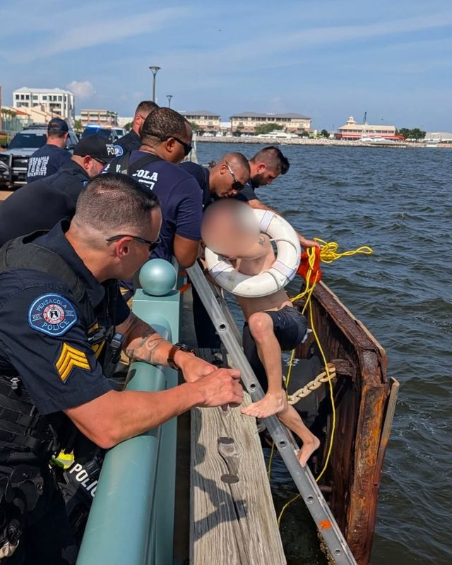 Pensacola police and firefighters rescued a man who fell into Pensacola Bay Saturday trying to grab his fishing pole. He was pushed 200 yards before officers could remove him.