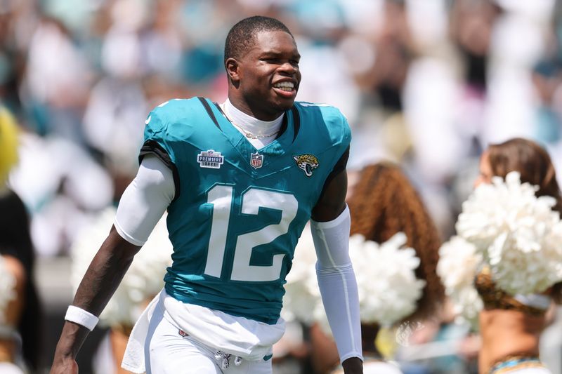 Sep 7, 2025; Jacksonville, Florida, USA; Jacksonville Jaguars wide receiver Travis Hunter (12) takes the field prior to a game against the Carolina Panthers at EverBank Stadium. Mandatory Credit: Nathan Ray Seebeck-Imagn Images