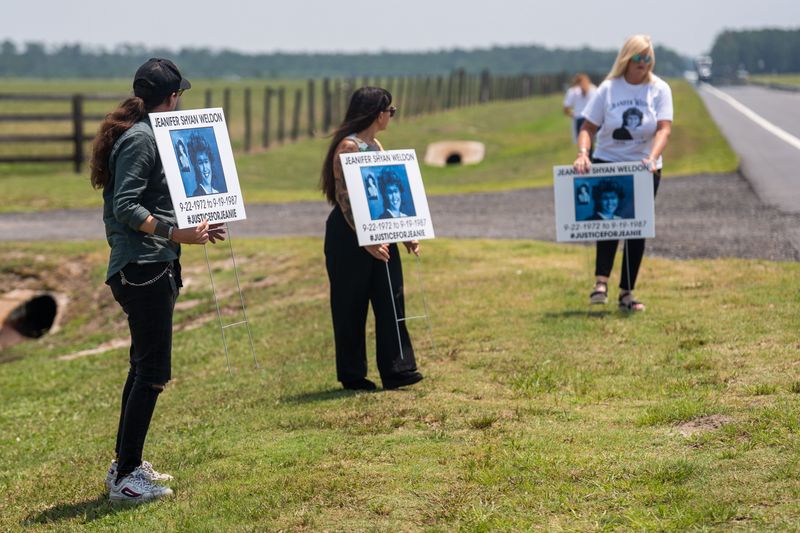Friends and family of Jeanifer Weldon put signs in remembrance of her during a press conference following the execution of former Florida police officer James Duckett on Tuesday, July 28, 2026.
