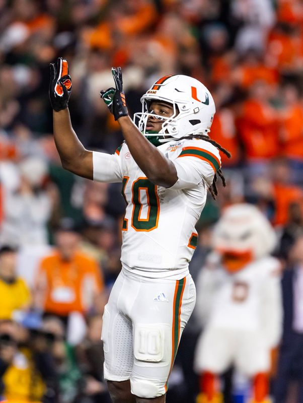 Jan 19, 2026; Miami Gardens, FL, USA; Miami Hurricanes wide receiver Malachi Toney (10) celebrates after scoring a touchdown against the Indiana Hoosiers during the College Football Playoff National Championship game at Hard Rock Stadium.