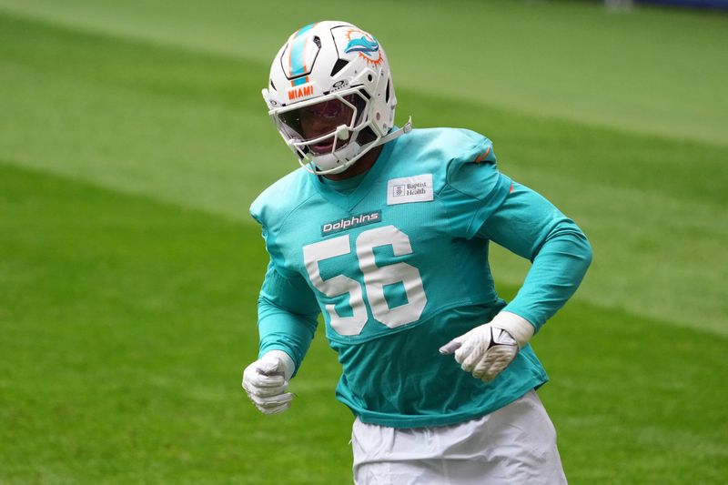 Nov 15, 2025; Madrid, Spain; Miami Dolphins linebacker Quinton Bell (56) during practice at Estadio Riyadh Air Metropolitano. Mandatory Credit: Kirby Lee-Imagn Images