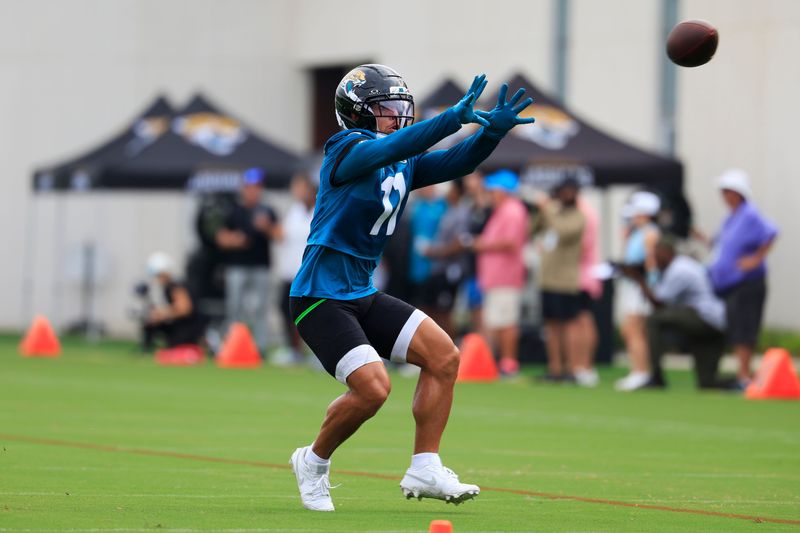 Jacksonville Jaguars wide receiver Parker Washington (11) catches a pass during the first day of NFL Training Camp at the Miller Electric Center on Wednesday, July 29, 2026, in Jacksonville, Fla.