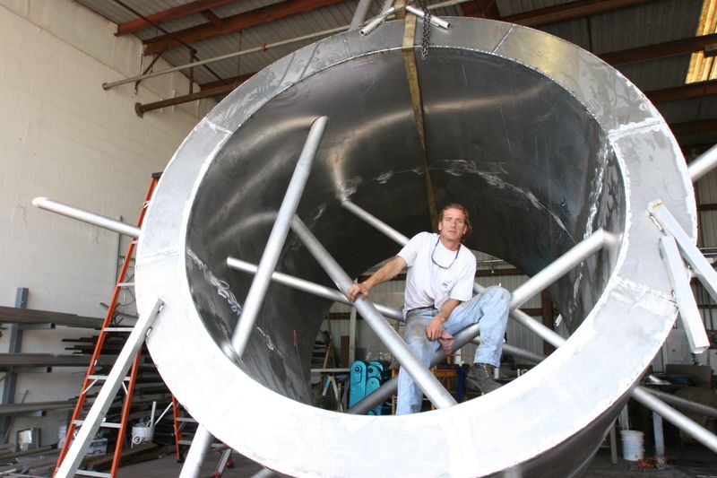 Late Fort Myers sculptor James DiGiorgio poses with his sculpture "You Are Here” in 2006. The recently restored sculpture now lives on the Alliance for the Arts campus.