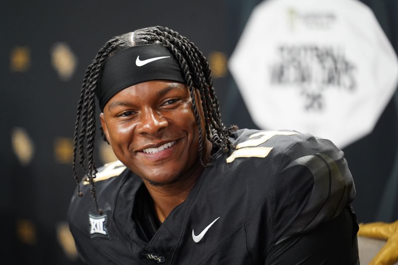Jul 7, 2026; Frisco, TX, USA;  UCF quarterback Alonza Barnett III speaks with reporters during Big 12 Conference Football Media Days at The Star. Mandatory Credit: Raymond Carlin III-Imagn Images
