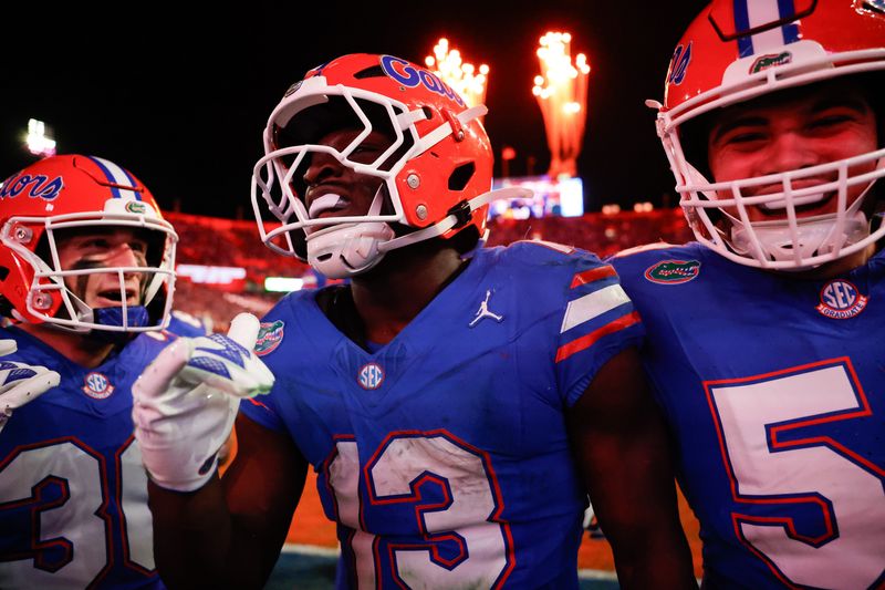 Nov 29, 2025; Gainesville, Florida, USA; Florida Gators running back Jadan Baugh (13) celebrates his touchdown during the fourth quarter against the Florida State Seminoles at Ben Hill Griffin Stadium. Mandatory Credit: Bob Kupbens-Imagn Images