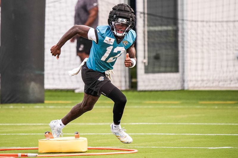 Jacksonville Jaguars Cornerback/Wide Receiver Travis Hunter (12) runs a drill during the fourth day of NFL Training Camp in shells at the Miller Electric Center on Thursday, July 30, 2026, in Jacksonville, Fla.  [Doug Engle/Florida Times-Union]