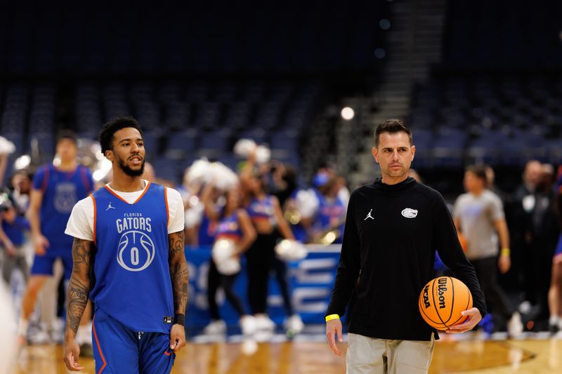 Mar 19, 2026; Tampa, FL, USA; Florida Gators guard Boogie Fland (0) and Florida Gators head coach Todd Golden look on during a practice session ahead of the first round of the men's 2026 NCAA Tournament at Benchmark International Arena. Mandatory Credit: Matt Pendleton-Imagn Images
