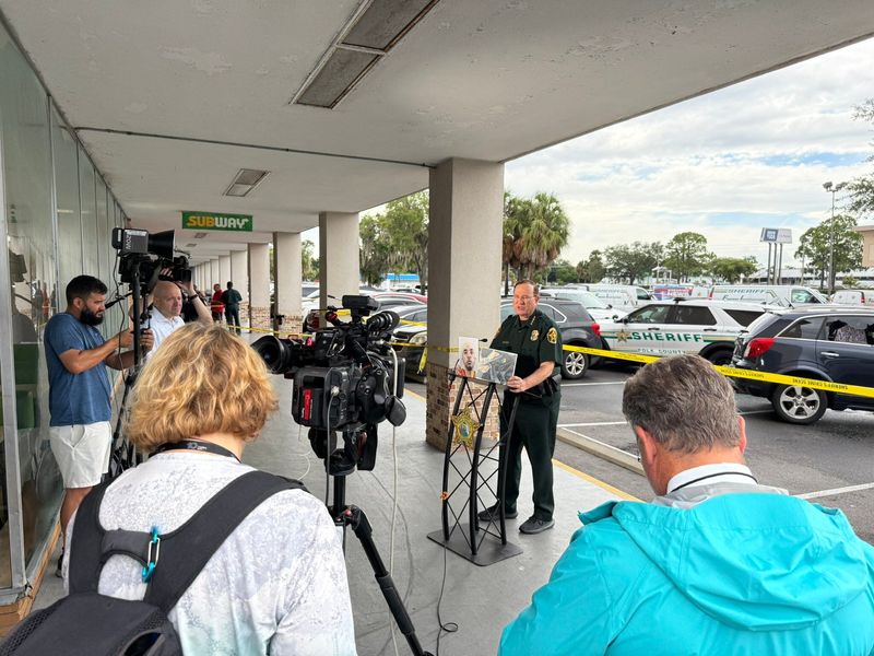 Polk County Sheriff Grady Judd discusses the fatal shooting of a man in a West Lakeland parking lot. The sheriff said the man was wanted for violating probation, and deputies had blocked him into a space at a shopping center when he pulled a weapon.