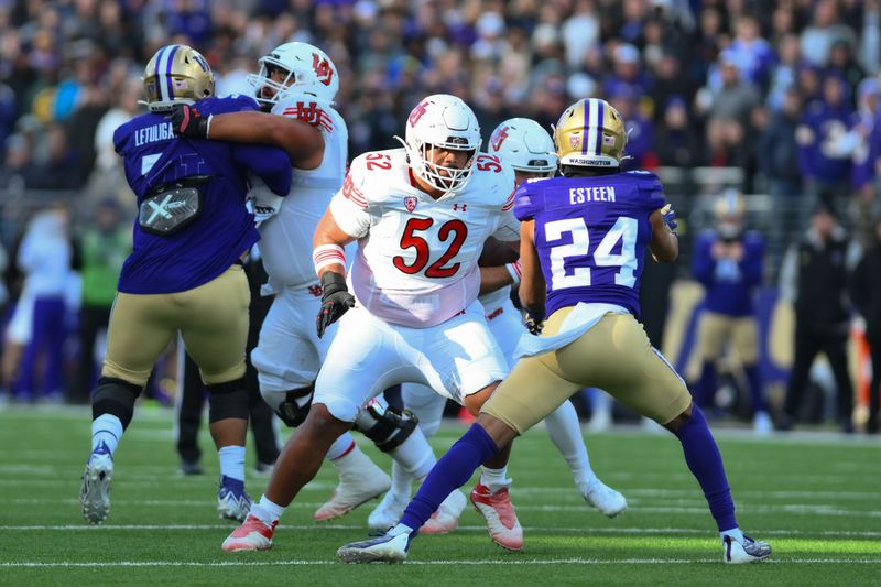 Nov 11, 2023; Seattle, Washington, USA; Utah Utes offensive lineman Michael Mokofisi (52) blocks Washington Huskies safety Makell Esteen (24) during the game at Alaska Airlines Field at Husky Stadium. Mandatory Credit: Steven Bisig-USA TODAY Sports