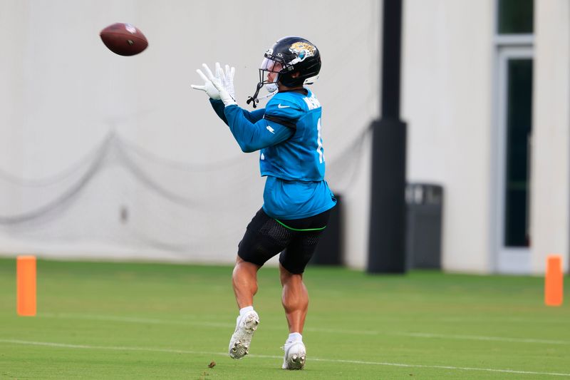 Jacksonville Jaguars wide receiver Parker Washington (11) catches a pass during the sixth day of NFL training camp at the Miller Electric Center on Tuesday, Aug. 4, 2026, in Jacksonville, Fla.