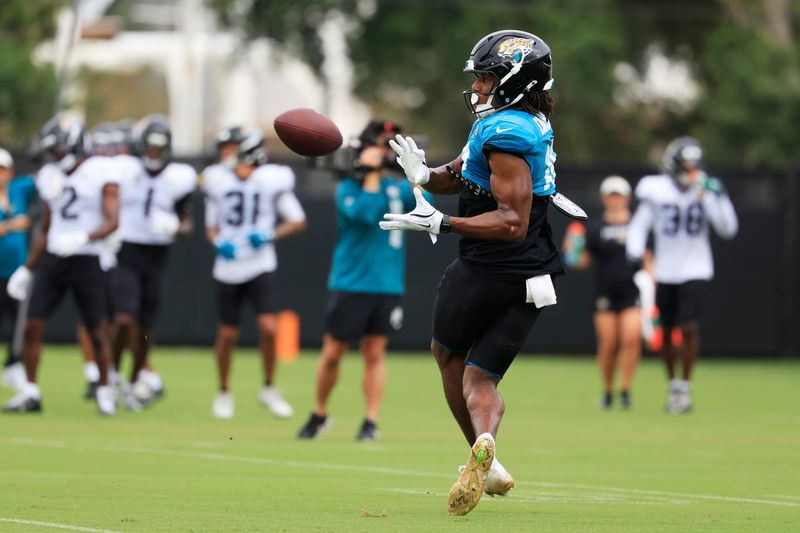 Jacksonville Jaguars wide receiver Josh Cameron (19) catches a pass during the sixth day of NFL training camp at the Miller Electric Center on Tuesday, Aug. 4, 2026, in Jacksonville, Fla.