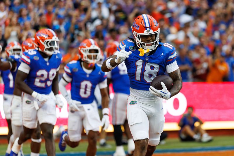 Aug 30, 2025; Gainesville, Florida, USA; Florida Gators defensive back Bryce Thornton (18) celebrates after scoring a touchdown against the Long Island Sharks during the first half at Ben Hill Griffin Stadium. Mandatory Credit: Matt Pendleton-Imagn Images