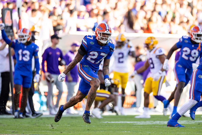 Nov 16, 2024; Gainesville, Florida, USA; Florida Gators defensive back Dijon Johnson (27) celebrates after a defensive stop against the LSU Tigers during the first half at Ben Hill Griffin Stadium. Mandatory Credit: Matt Pendleton-Imagn Images