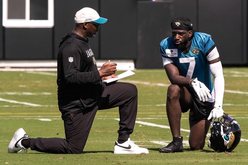 Jaguar’s Wide Receivers Coach Edgar Bennett talks with Jacksonville Jaguars Wide Receiver Brian Thomas Jr. (7) 
after the Jacksonville Jaguars seventh day of NFL Training Camp at the Miller Electric Center in Jacksonville, Fla., Thursday August 6, 2026.    [Doug Engle/Florida Times-Union]