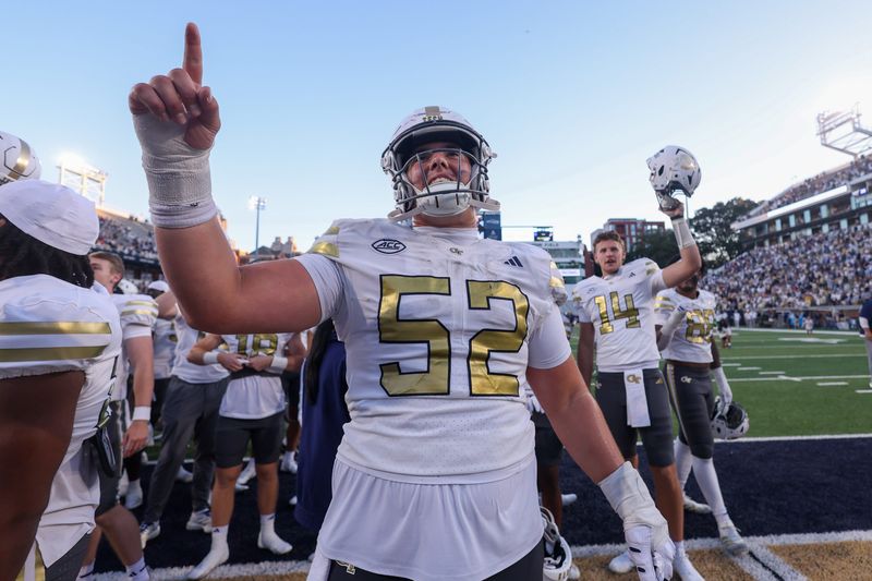 Oct 11, 2025; Atlanta, Georgia, USA; Georgia Tech Yellow Jackets offensive guard Harrison Moore (52) celebrates after a victory over the Virginia Tech Hokies in the fourth quarter at Bobby Dodd Stadium at Hyundai Field. Mandatory Credit: Brett Davis-Imagn Images
